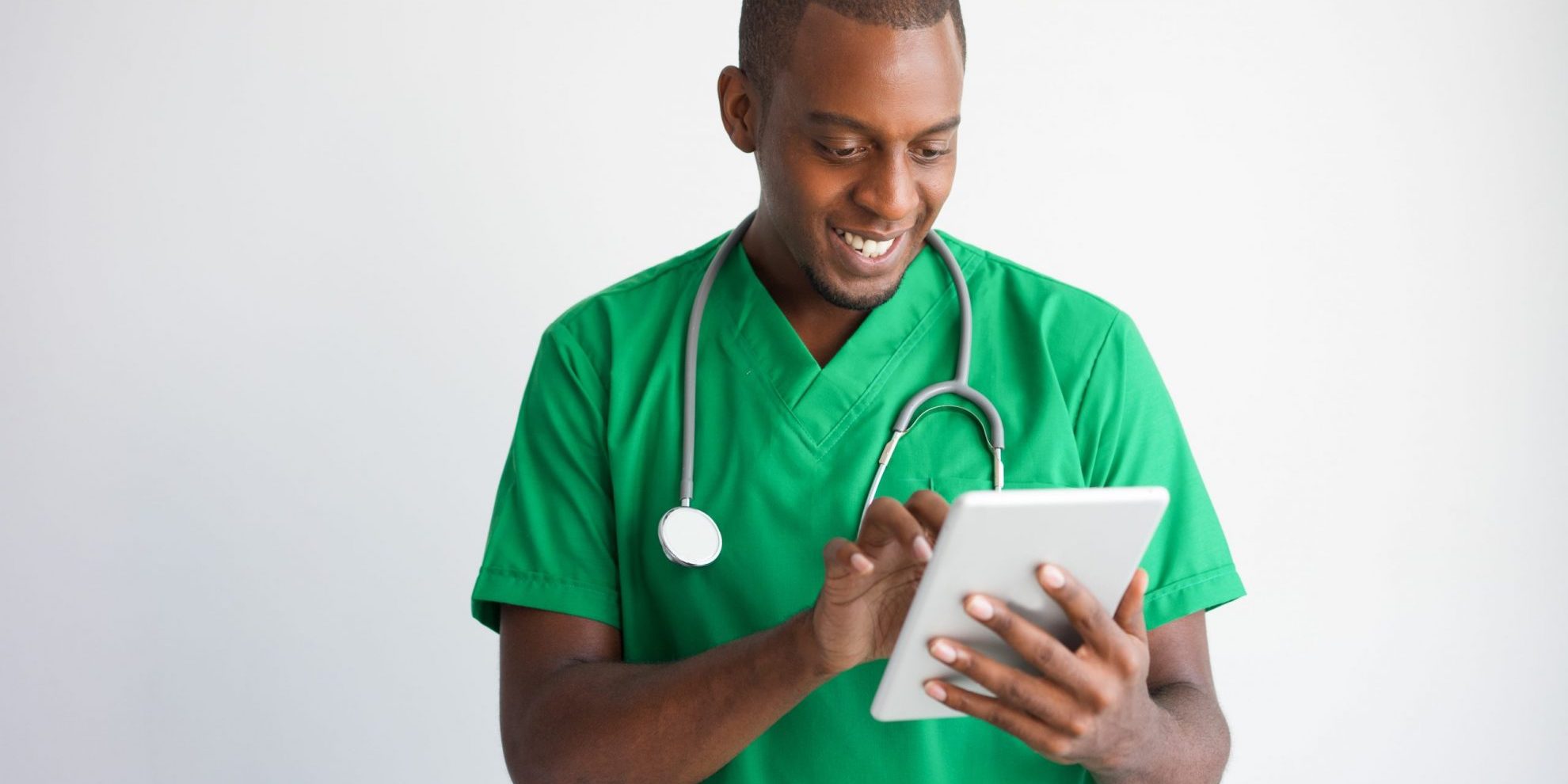 Photo of doctor looking at tablet illustrates blog: "California Emergency Regulations for Medical Legal Evaluations To Remain in Place Through January 2023"