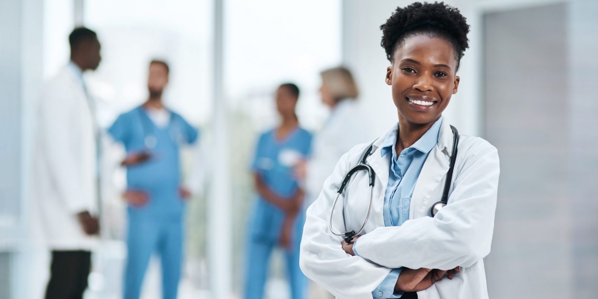 Photo of smiling doctor illustrates blog "California’s DWC To Hold Public Hearing in March for Proposed Amendments to QME Regulations"