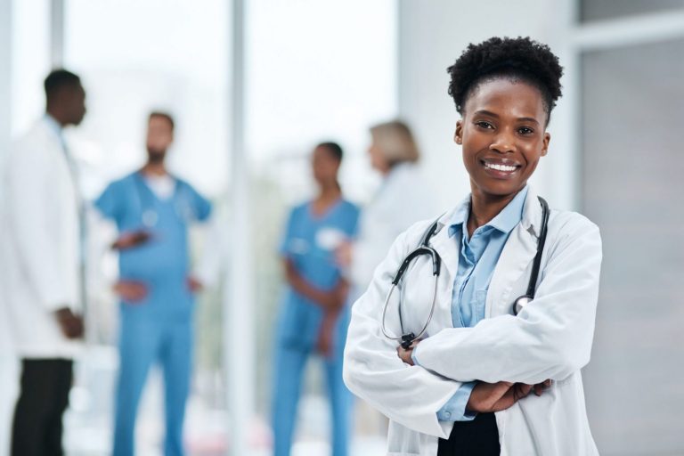 Photo of smiling doctor illustrates blog "California’s DWC To Hold Public Hearing in March for Proposed Amendments to QME Regulations"