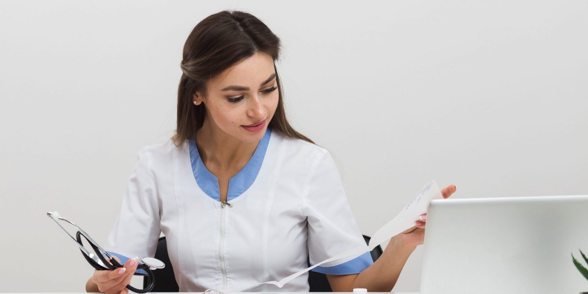 Photo of woman looking at documents illustrates blog "Can I Withdraw a request for Independent Bill Review (IBR)?"
