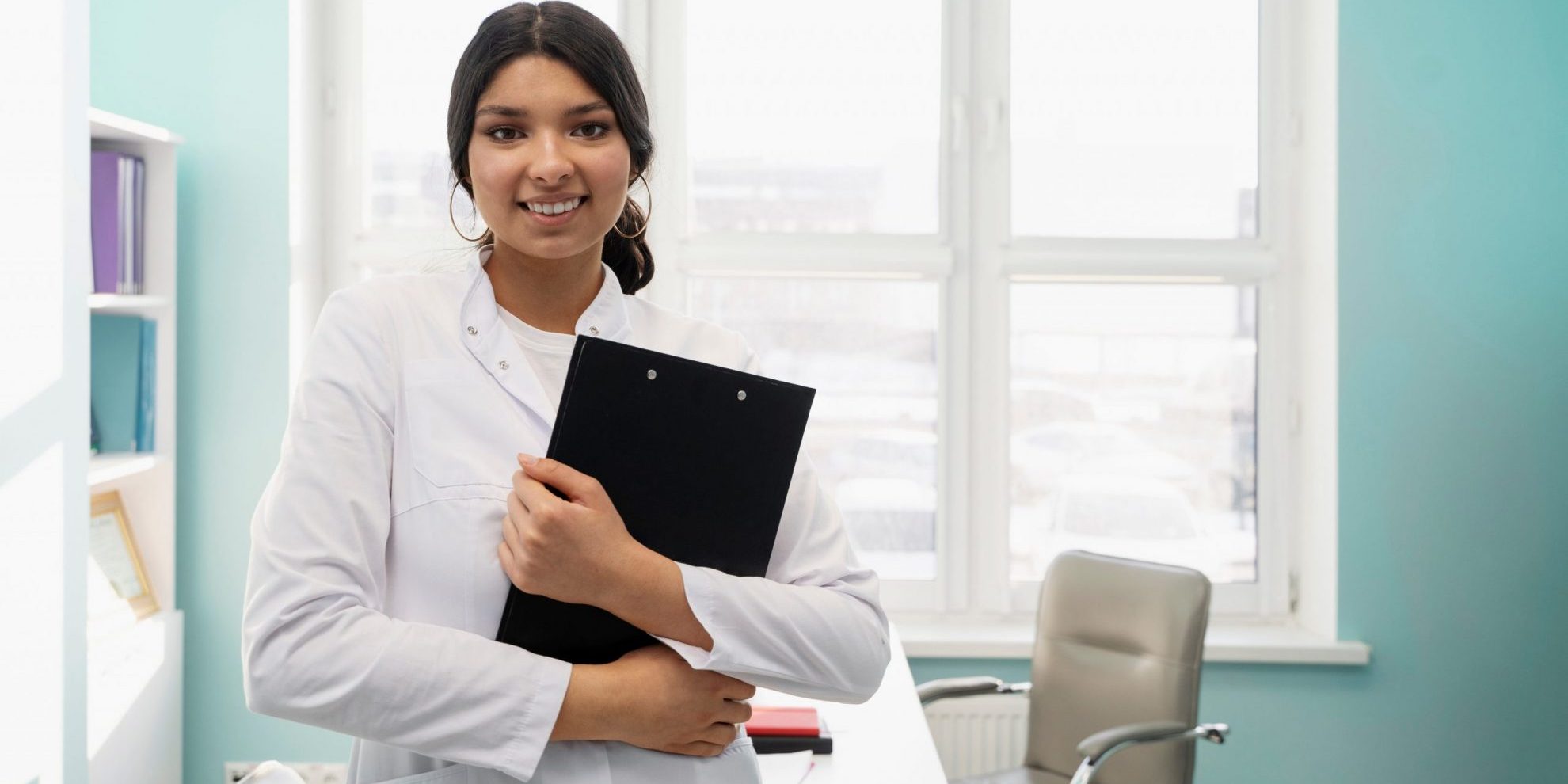 Female doctor holding clipboard illustrates blog "Is There a Fee To Be a QME in California?"