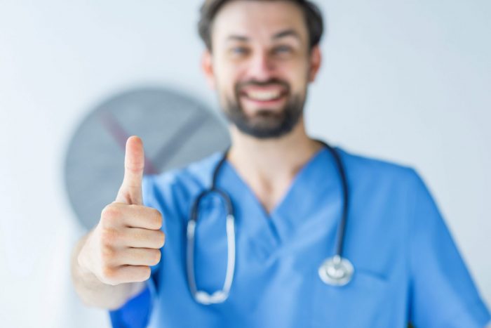Healthcare professional giving the thumbs-up illustrate blog "5 Medical Billing Tips To Accelerate Your Practice’s Revenue Cycle"