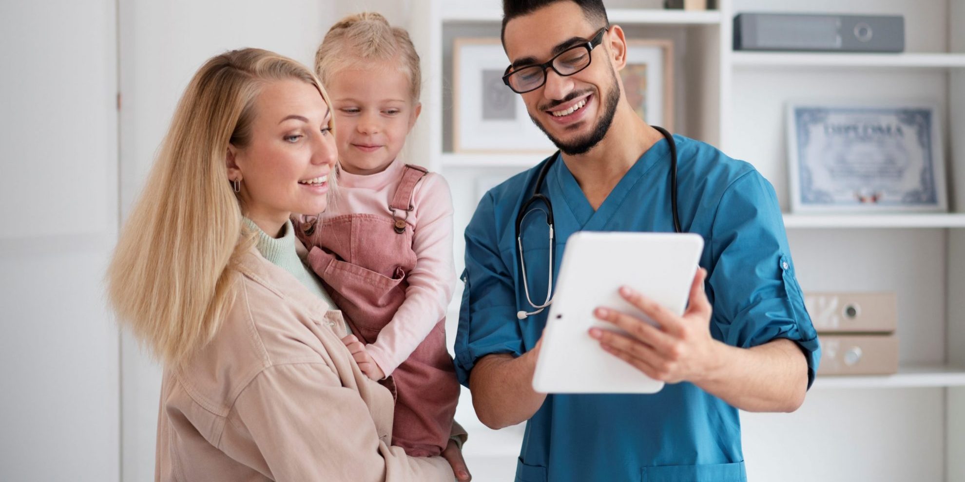 Young doctor talking to woman and child illustrates blog "4 Tips to Grow Your Medical Practice"