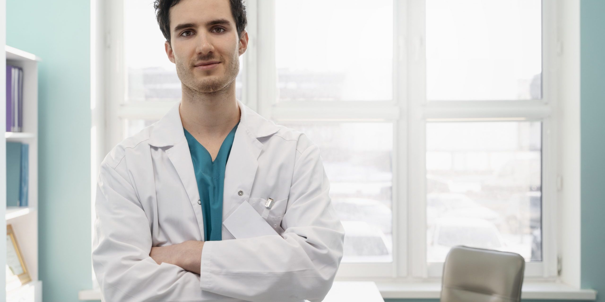 Male doctor with crossed arms illustrates blog "5 Tips to Increase Revenue in Your Medical Practice"