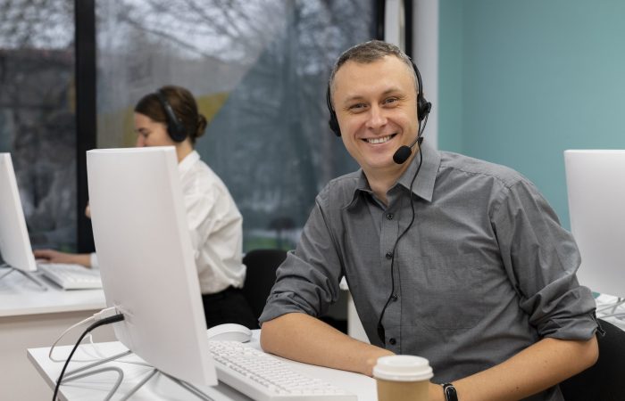 call-center-man-fp Male call center agent wearing headset illustrates blog "Healthcare Call Center Best Practices"