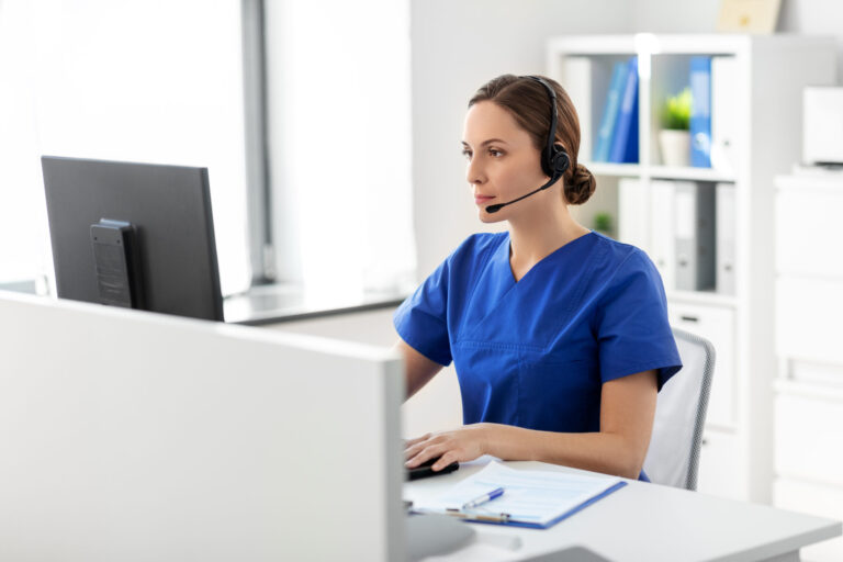 doctor with headset and computer at hospital