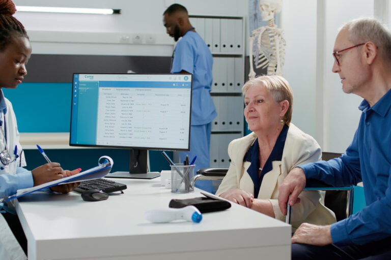 african-american-medic-talking-elderly-woman-with-disability-chekcup-visit-appointment-senior-patient-with-impairment-wheelchair-husband-receiving-medical-disease-treatment Outsourcing medical admin services for healthcare practices