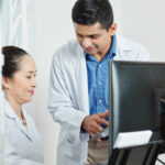 ealthcare team reviewing automated scheduling system to reduce inefficiencies