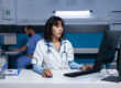 Healthcare staff managing medical admin workflows in a busy clinic office