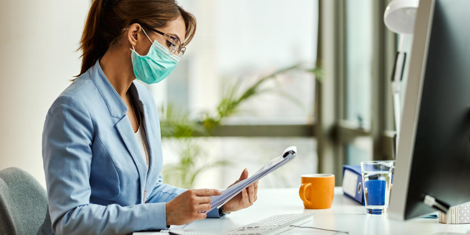 healthcare administrator analyzing revenue leakage healthcare data on computer