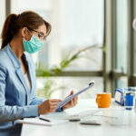 healthcare administrator analyzing revenue leakage healthcare data on computer