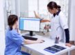 Healthcare staff performing an insurance verification audit at a medical office