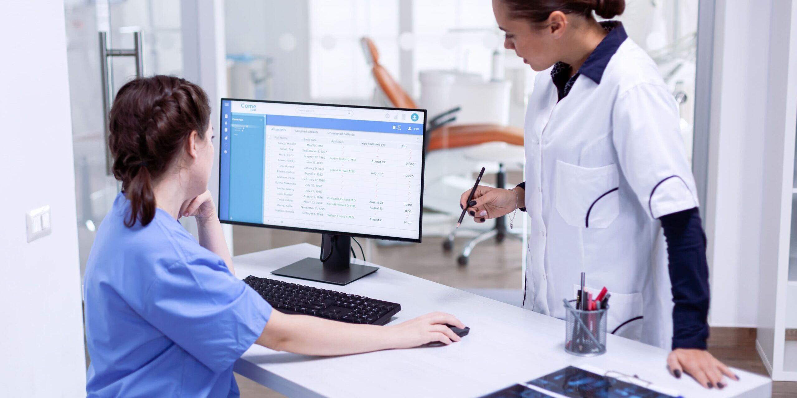 Healthcare staff performing an insurance verification audit at a medical office