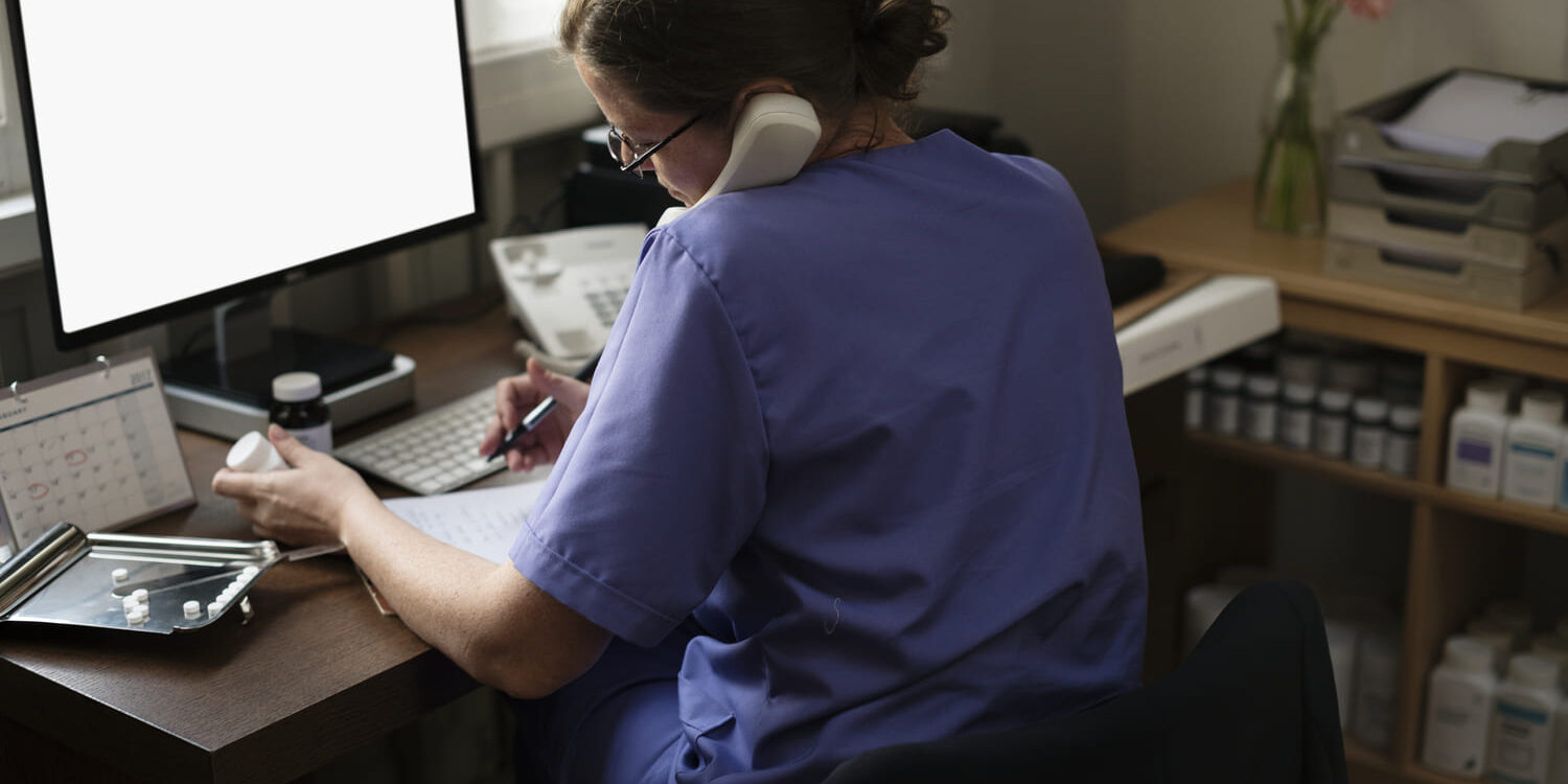 Healthcare staff reviewing admin processes in a medical office
