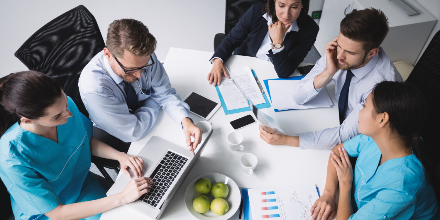 Healthcare team using administrative systems to support a growing medical group