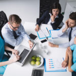 Healthcare team using administrative systems to support a growing medical group