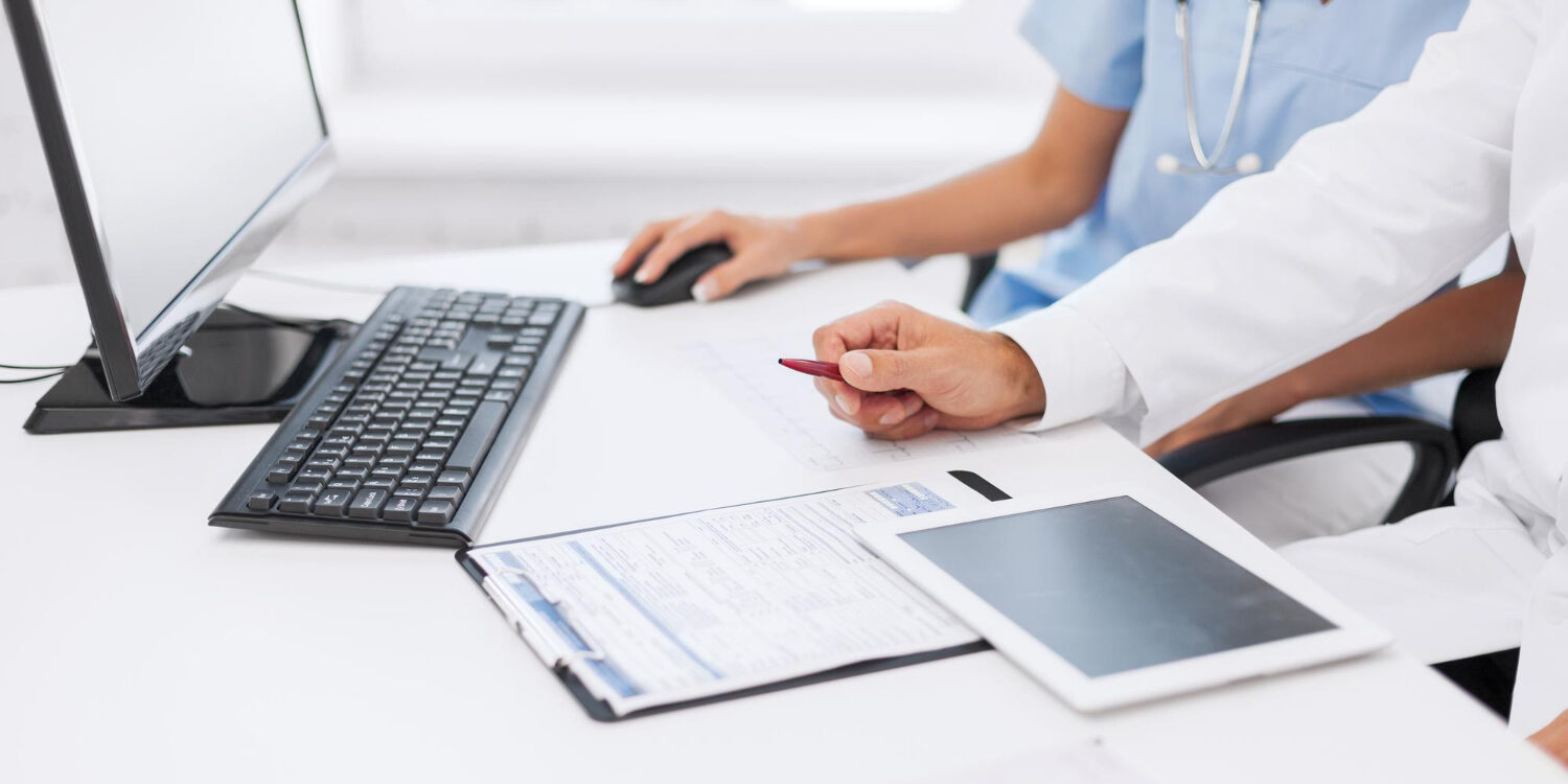 Healthcare staff performing eligibility verification before patient registration