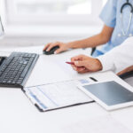 Healthcare staff performing eligibility verification before patient registration