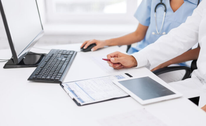 Healthcare staff performing eligibility verification before patient registration