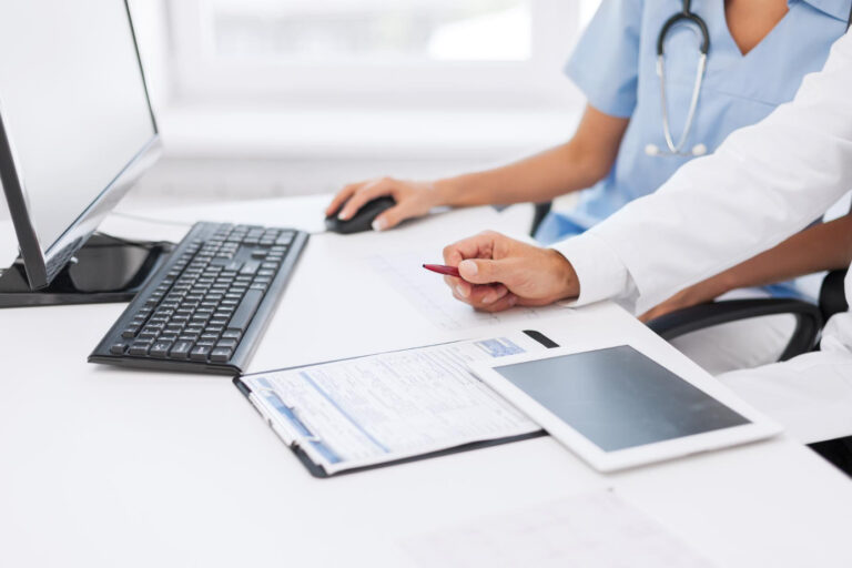 Healthcare staff performing eligibility verification before patient registration