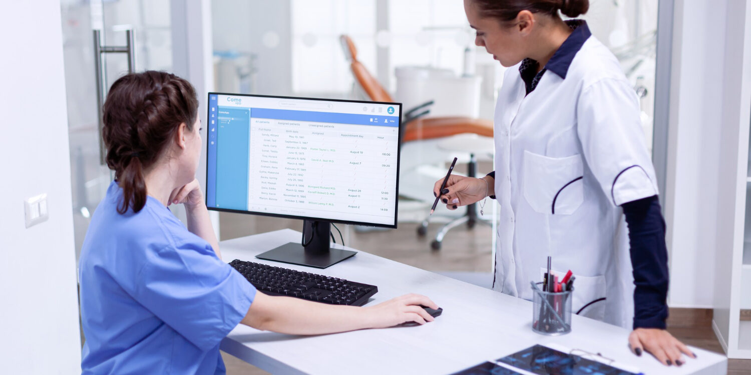 image-insurance-verification-backlogs Medical office team managing insurance verification backlogs and scheduling delays