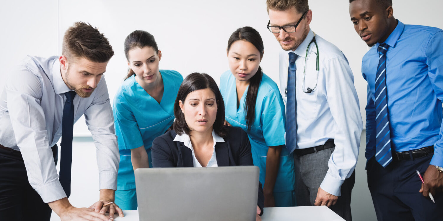 Healthcare team managing revenue cycle complexity in a mid-sized medical group
