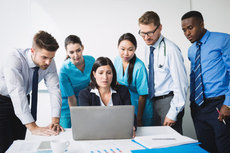 Healthcare team managing revenue cycle complexity in a mid-sized medical group
